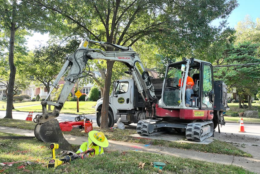 Fred Luth employees using construction equipment to dig and replace lead pipes